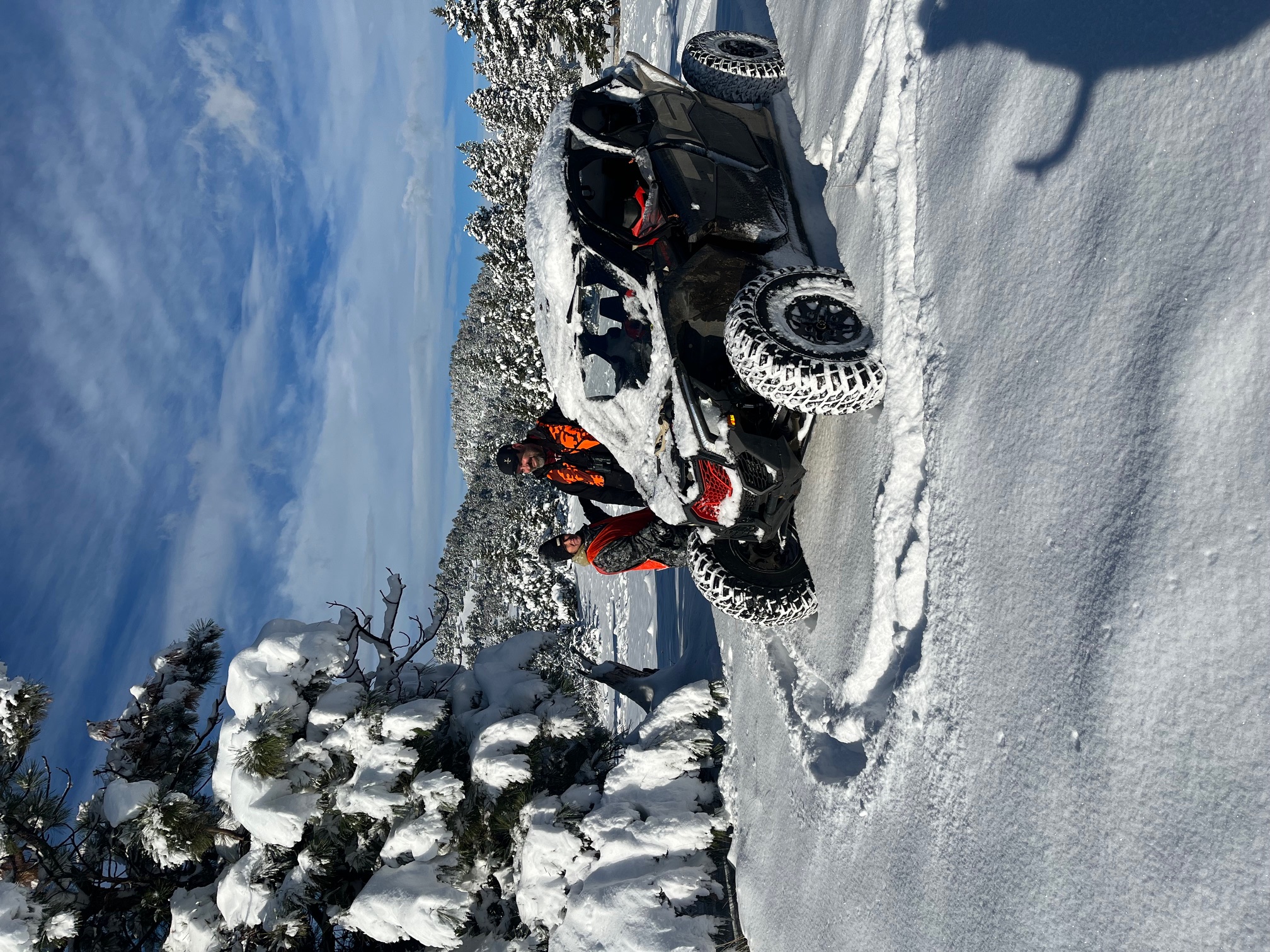 Winter terrain training with utility vehicle navigating snow-covered Montana mountains